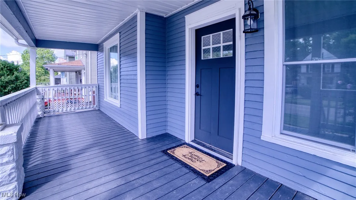 Property entrance with covered porch