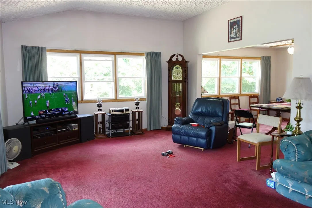Living room w/ High ceilings and an amazing view