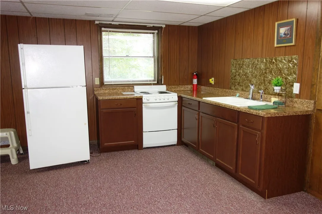 Family Room w/a 2nd kitchen, stove & fridge stay