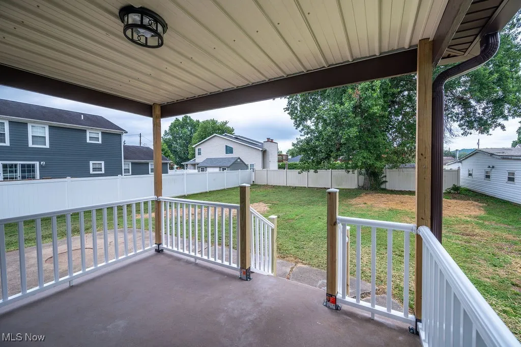 Fenced backyard featuring a patio area