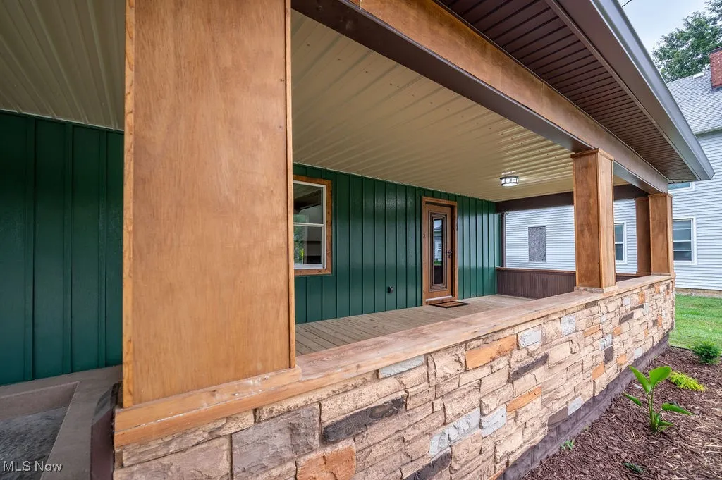 View of exterior entry featuring a porch