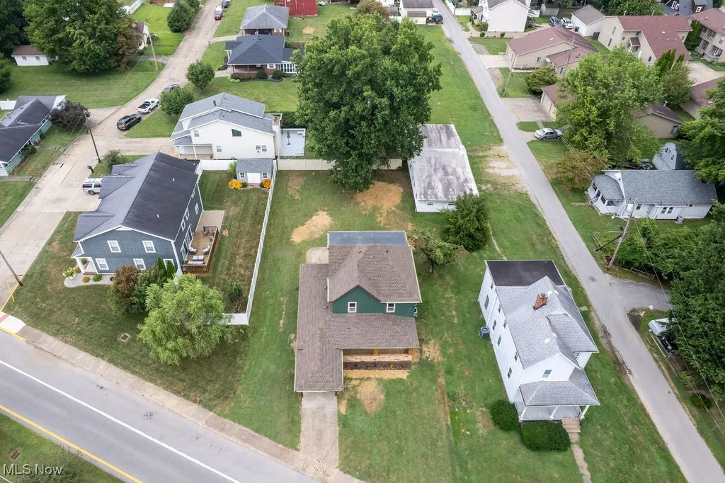 Aerial view of property's location with nearby suburban area