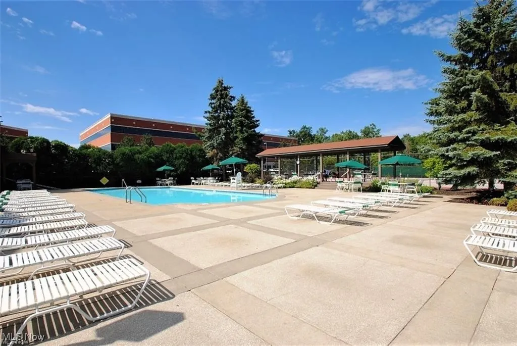 Community pool featuring a patio area