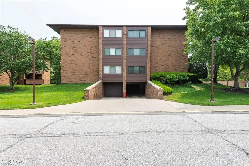 View of side of building and attached garage