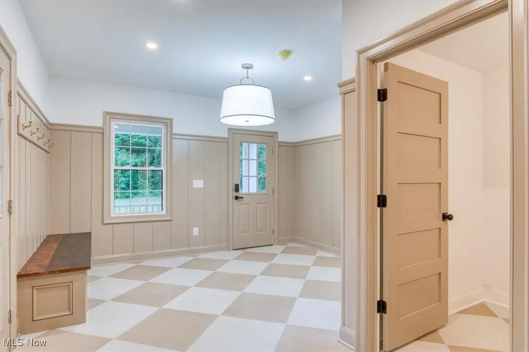 Mudroom/Laundry featuring light flooring and recessed lighting