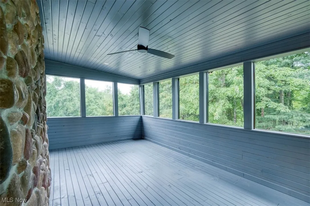 Master Bedroom Sunroom featuring a forest view with screens