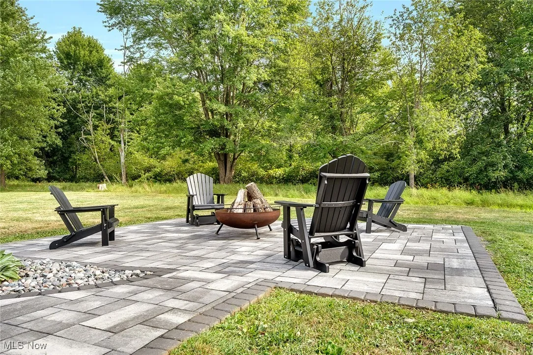 View of patio with a fire pit