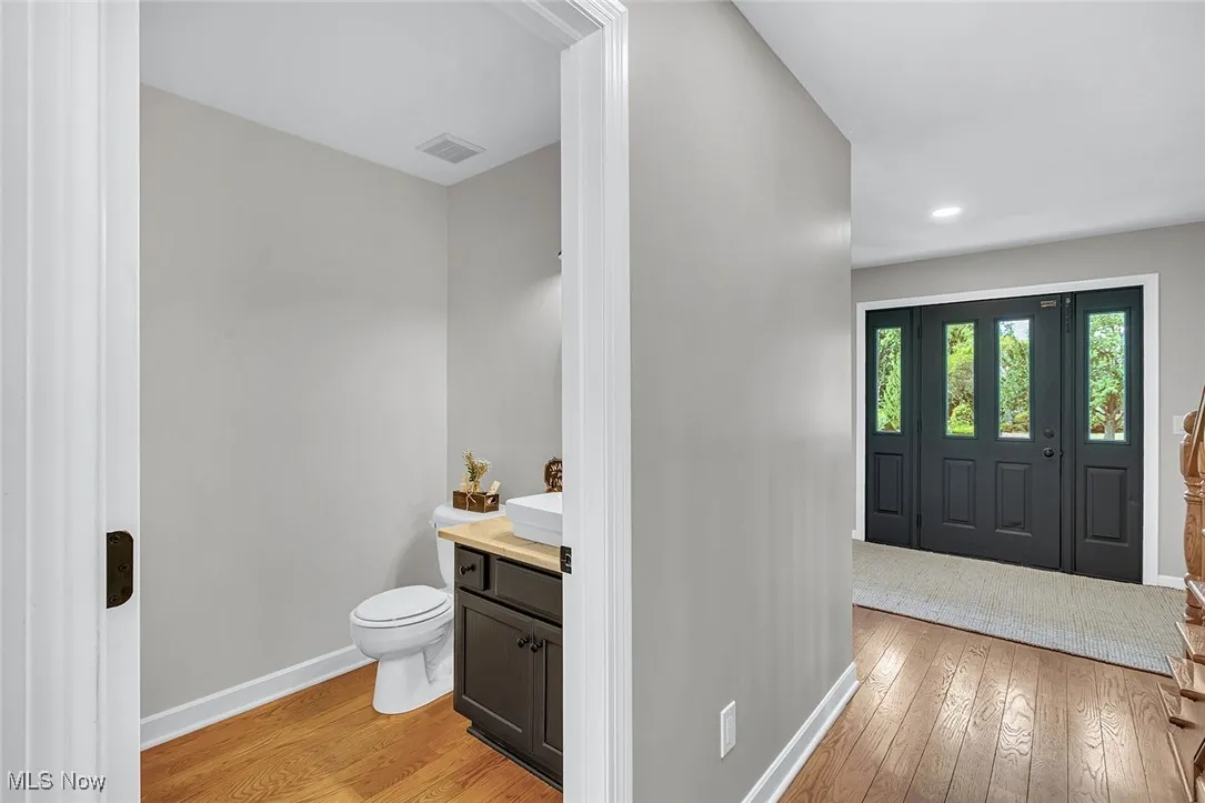 Bathroom featuring vanity and light wood finished floors