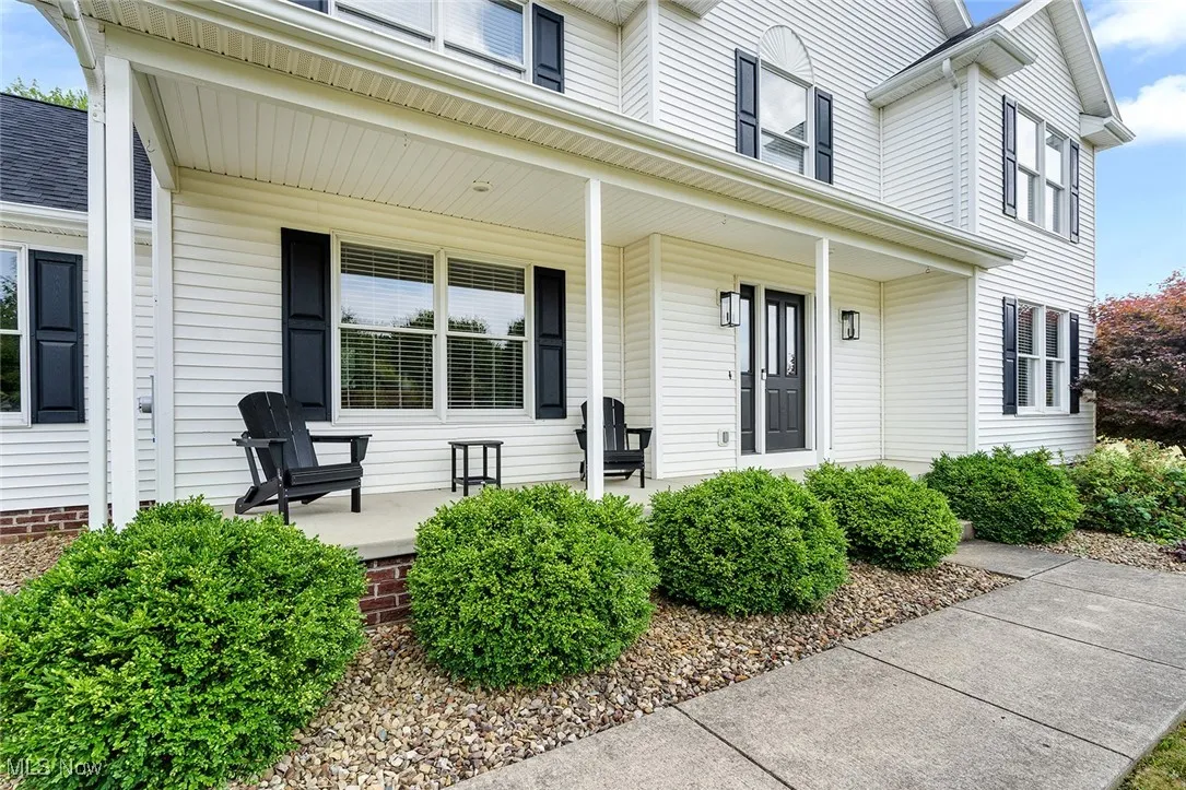 Doorway to property featuring a porch