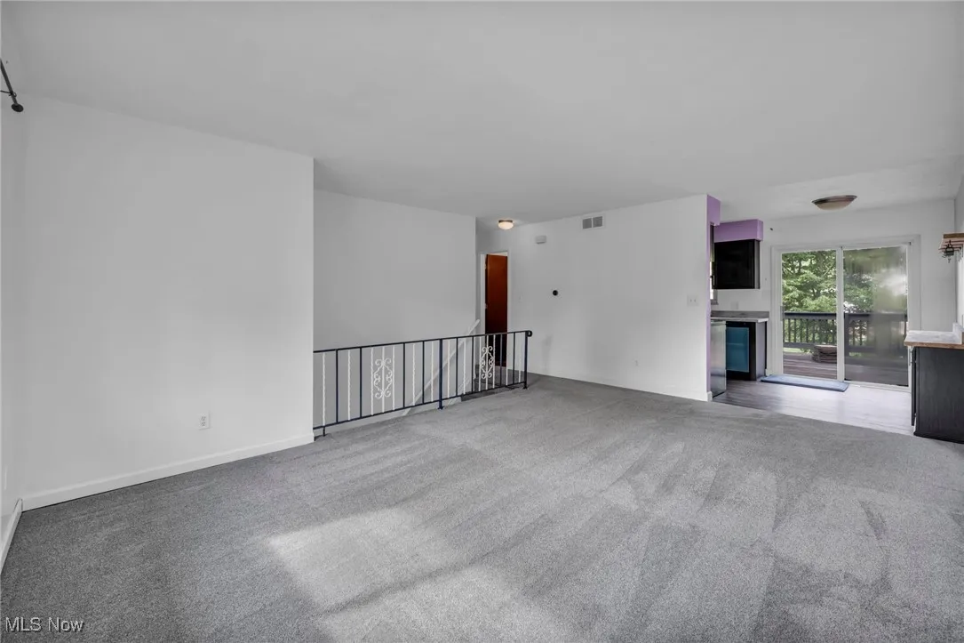 Living room with carpet and baseboards