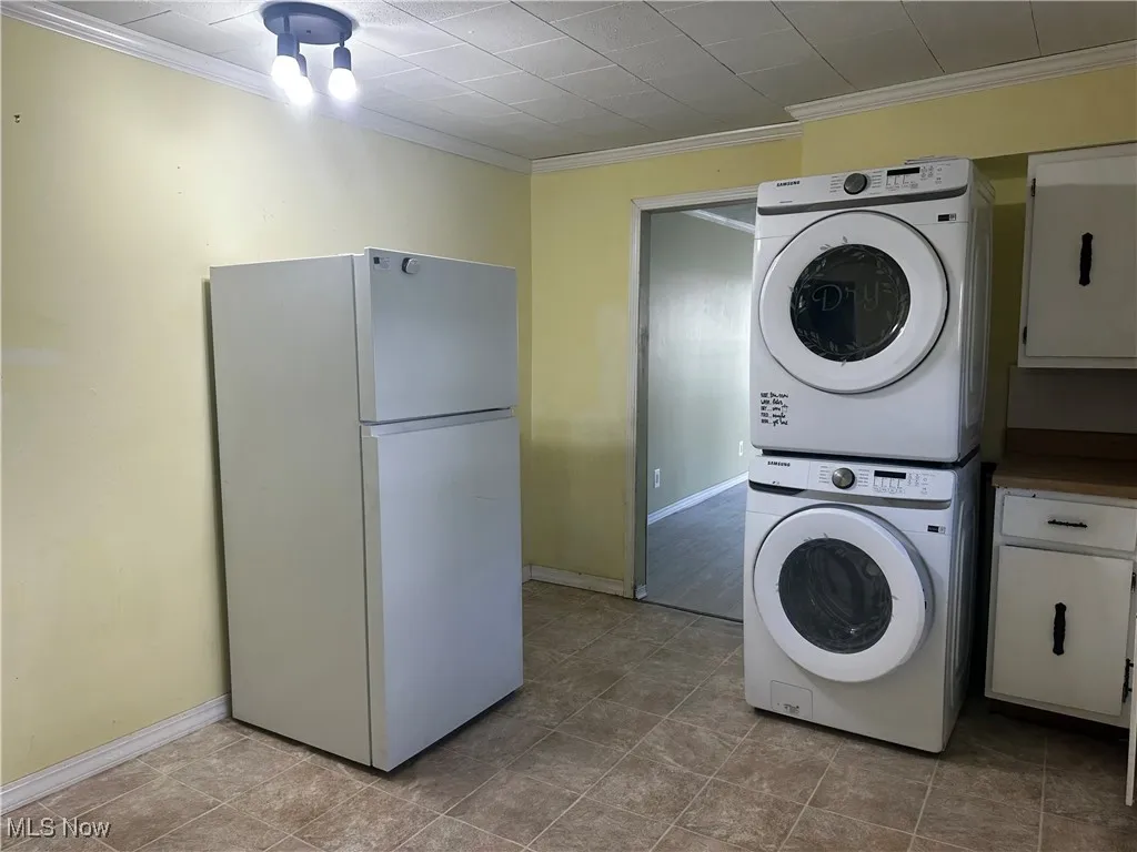Kitchen with washer and dryer and refrigerator
