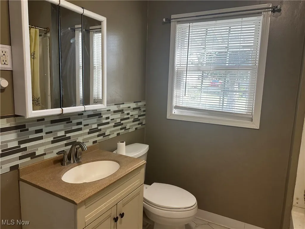 Bathroom with vanity and window