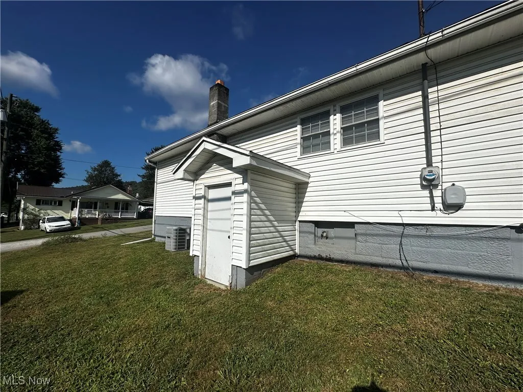 Side exterior with basement door