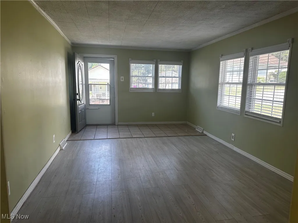 Living room with front entrance door