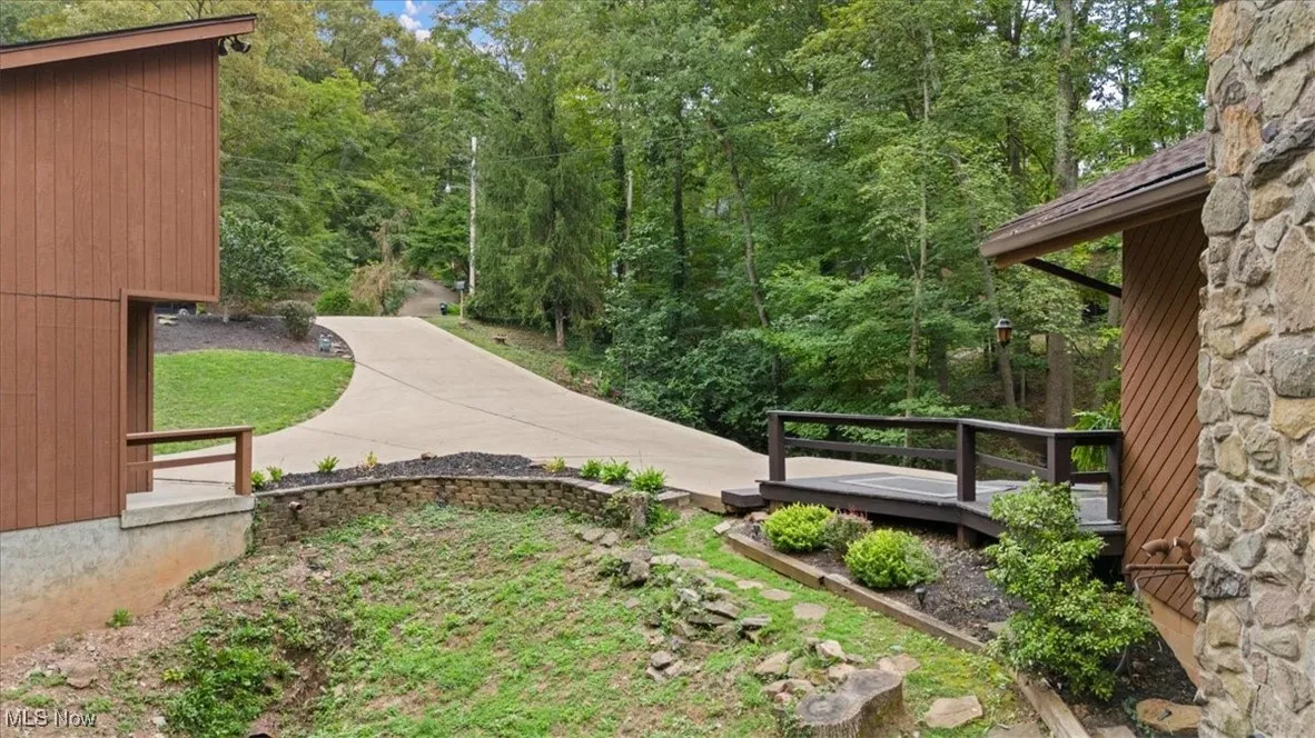 Looking Up Toward Road From Between House and Garage