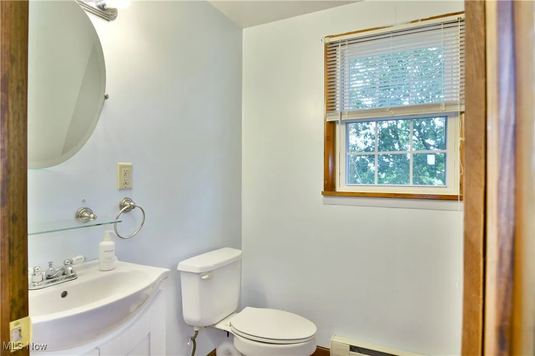 Bathroom featuring vanity and baseboard heating