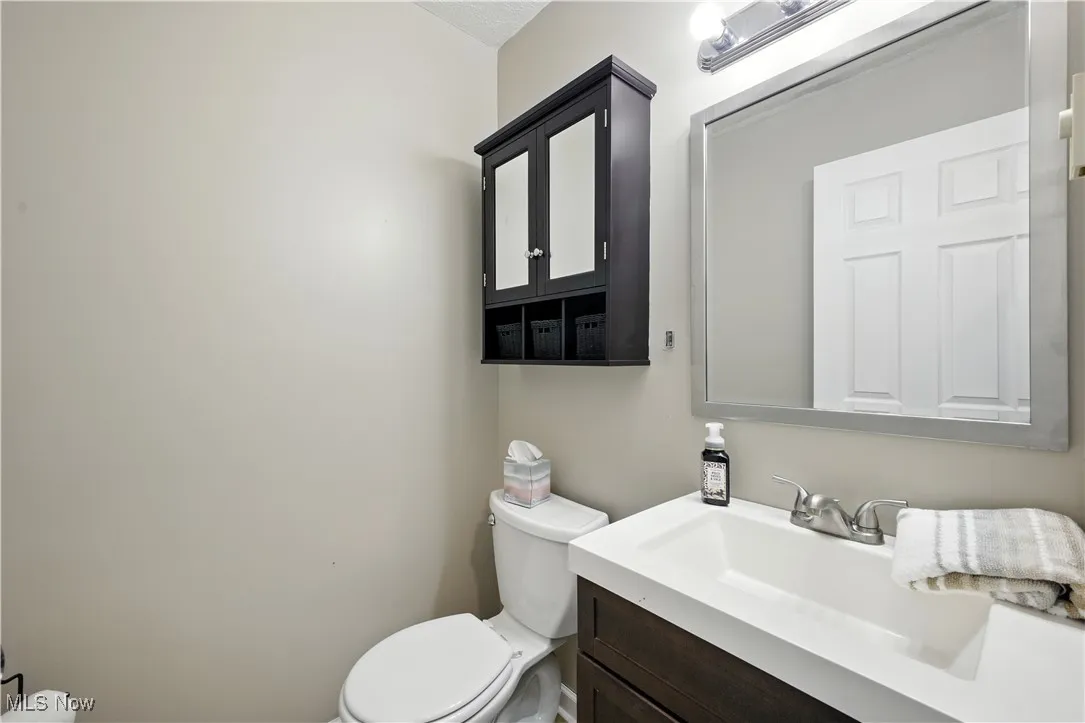 Bathroom featuring vanity and toilet