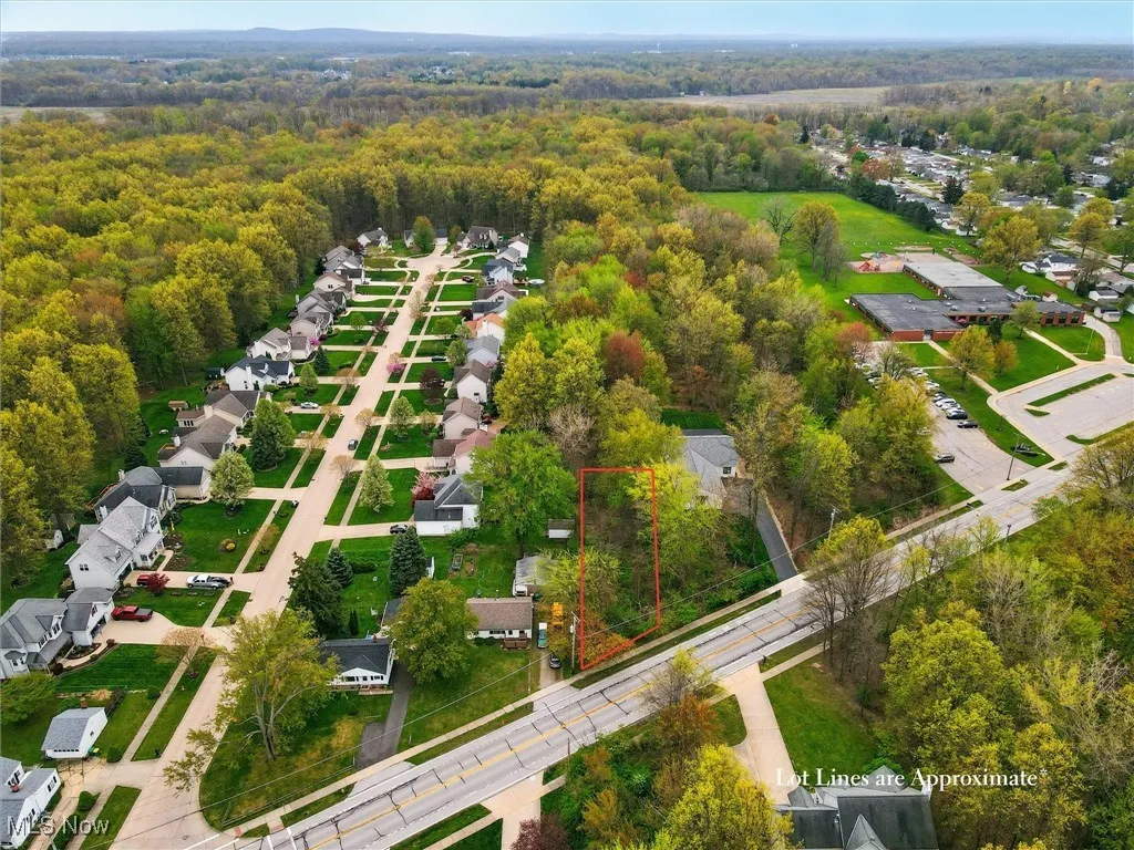 Aerial view with a forest view and a residential view