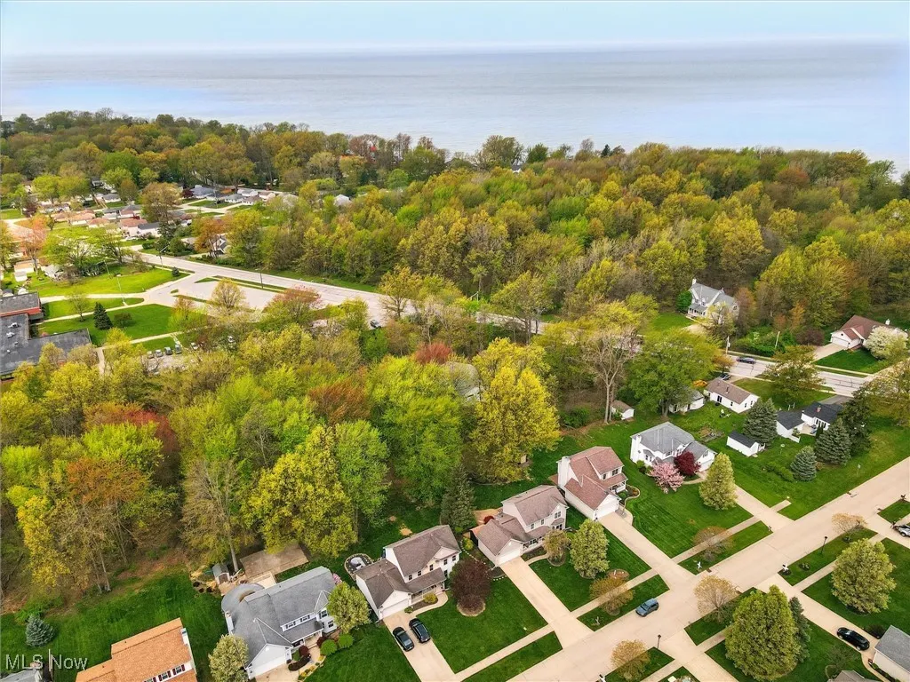 Drone / aerial view featuring a water view and a residential view