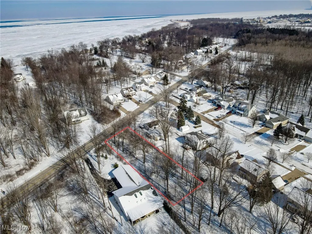 Snowy aerial view featuring a residential view