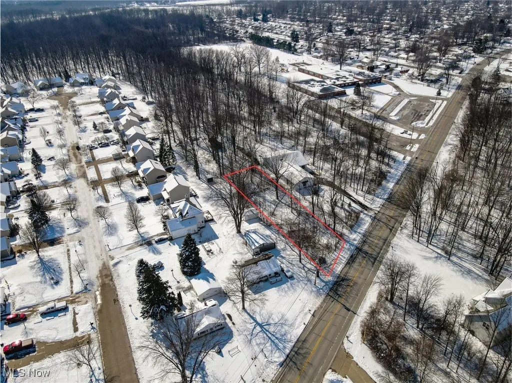 Snowy aerial view with a residential view
