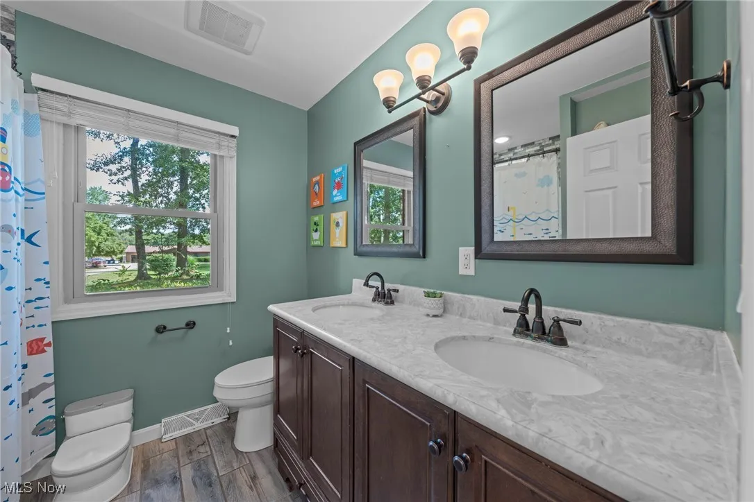Updated 2nd floor Bathroom with double vanity, tub and shower.