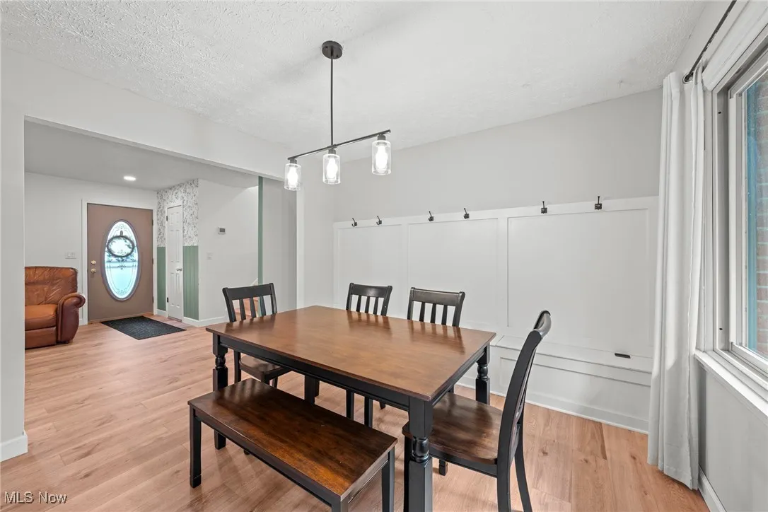 Open floor plan with Dining area adjacent to Living Room and Kitchen.