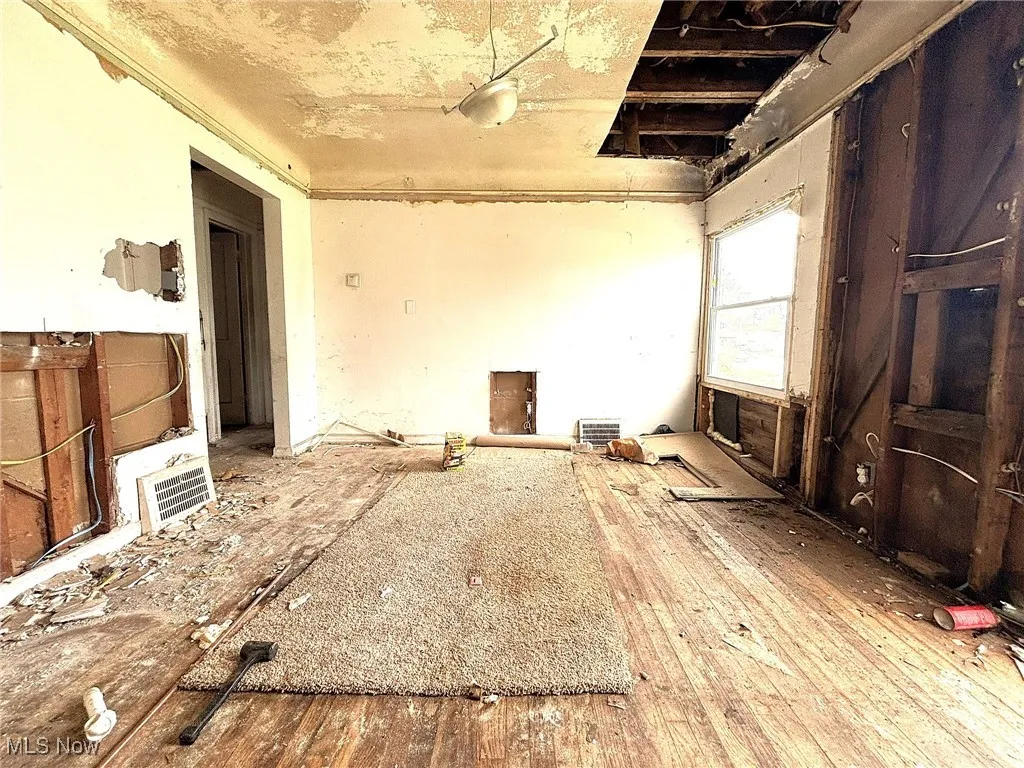 Miscellaneous room featuring wood-type flooring
