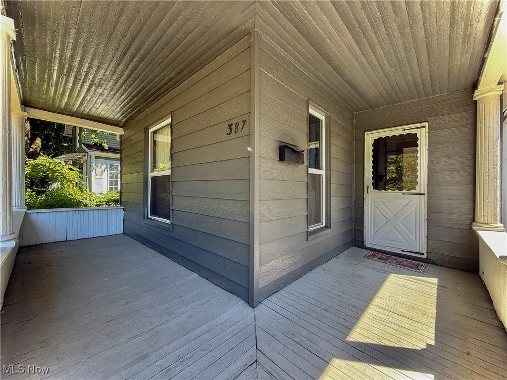 View of partial wrap around front porch