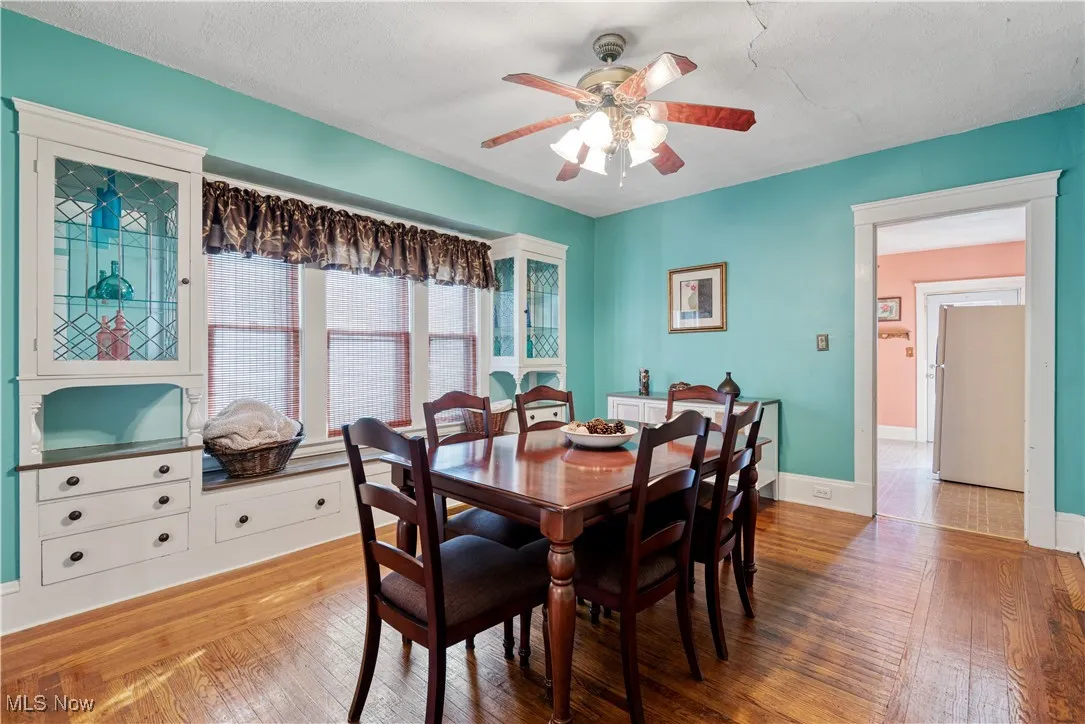 Dining area featuring light wood-style floors and a ceiling fan