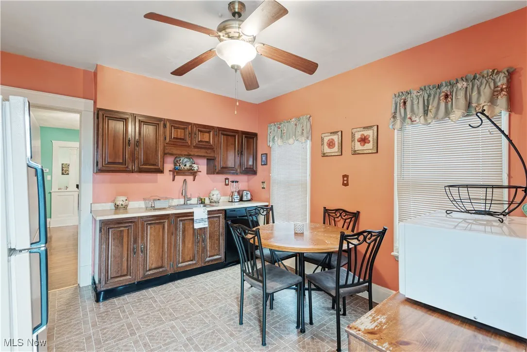 Dining space with baseboards and ceiling fan