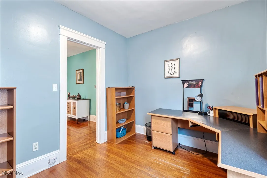 Office space with light wood finished floors and baseboards