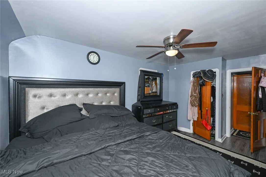 Bedroom featuring a ceiling fan and wood finished floors