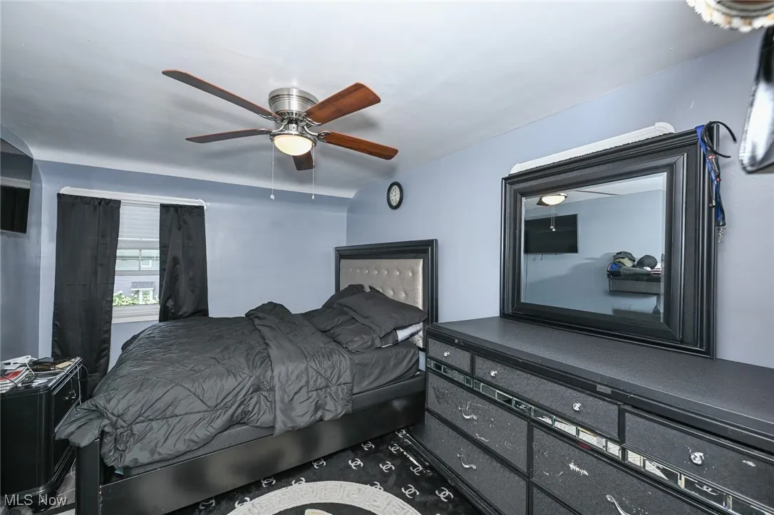 Bedroom featuring a ceiling fan