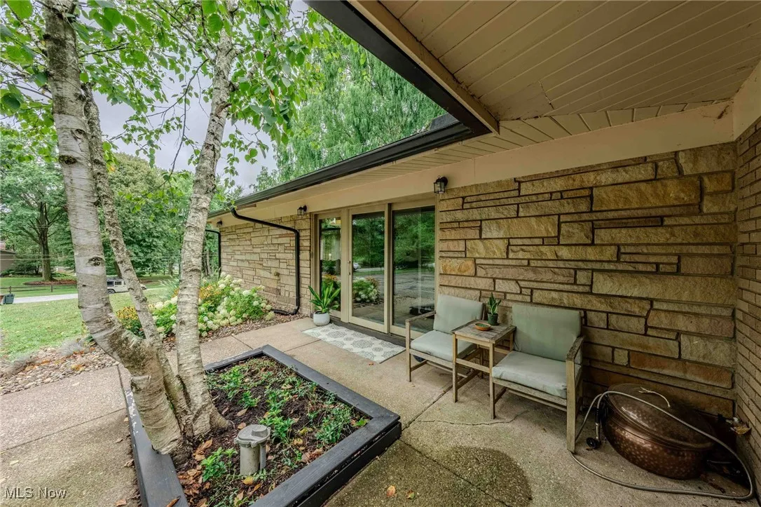 View of patio with a vegetable garden