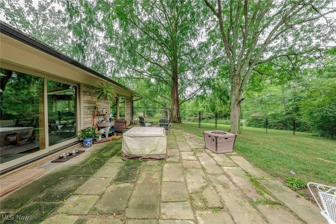 View of patio featuring a fire pit
