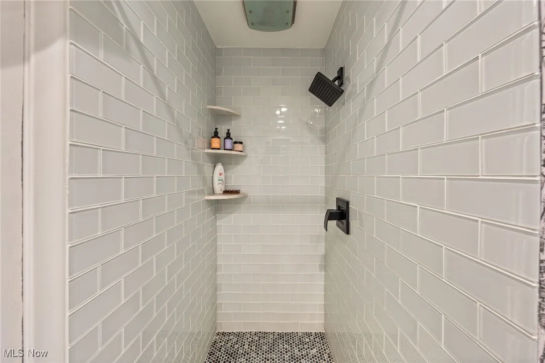 Bathroom with tiled shower