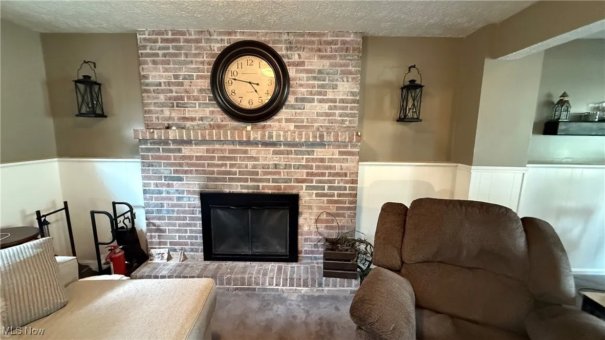 Family room featuring a beautiful wood burning fireplace