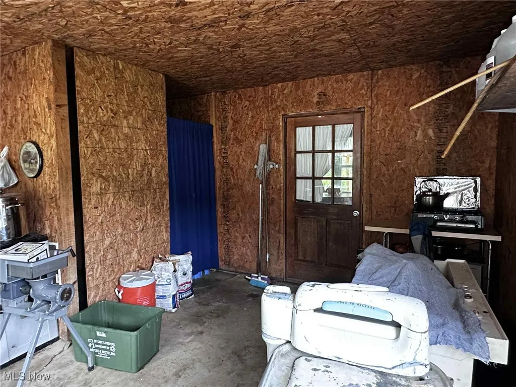 Misc room with unfinished concrete flooring