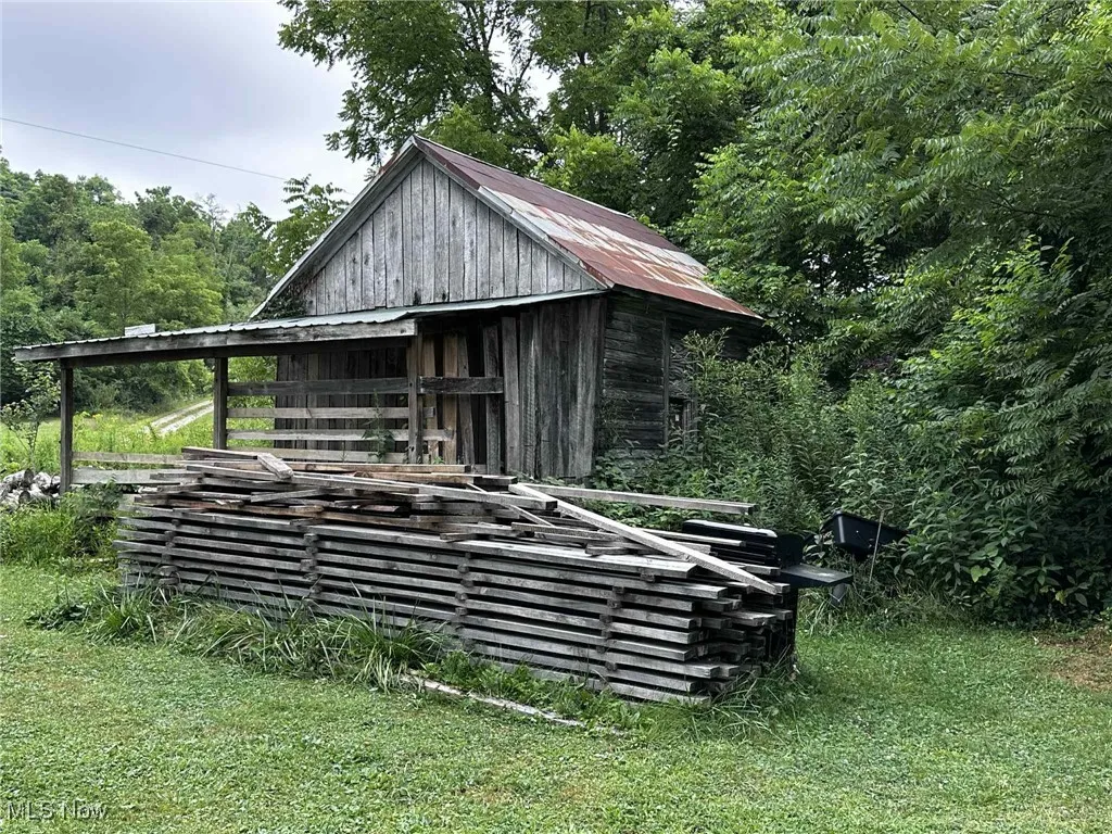 View of outdoor structure with a view of trees