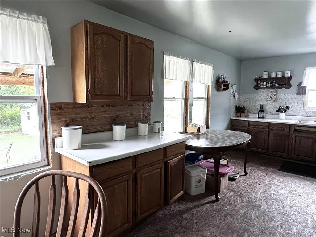 Kitchen featuring light countertops and decorative backsplash