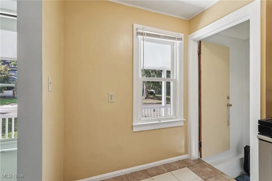 Other side of kitchen showing entrance to lower level