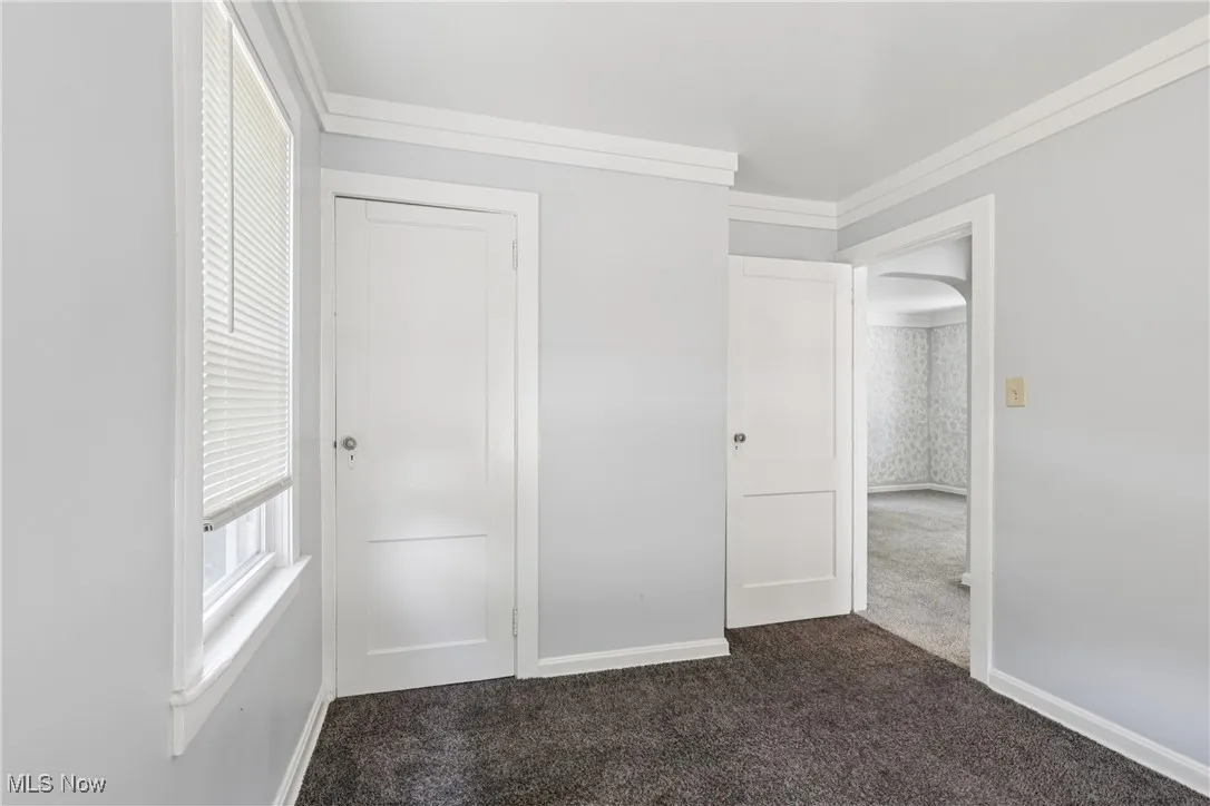 Bedroom with closet and carpet flooring