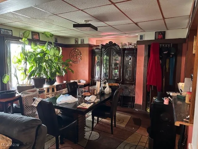 Dining room featuring a drop ceiling