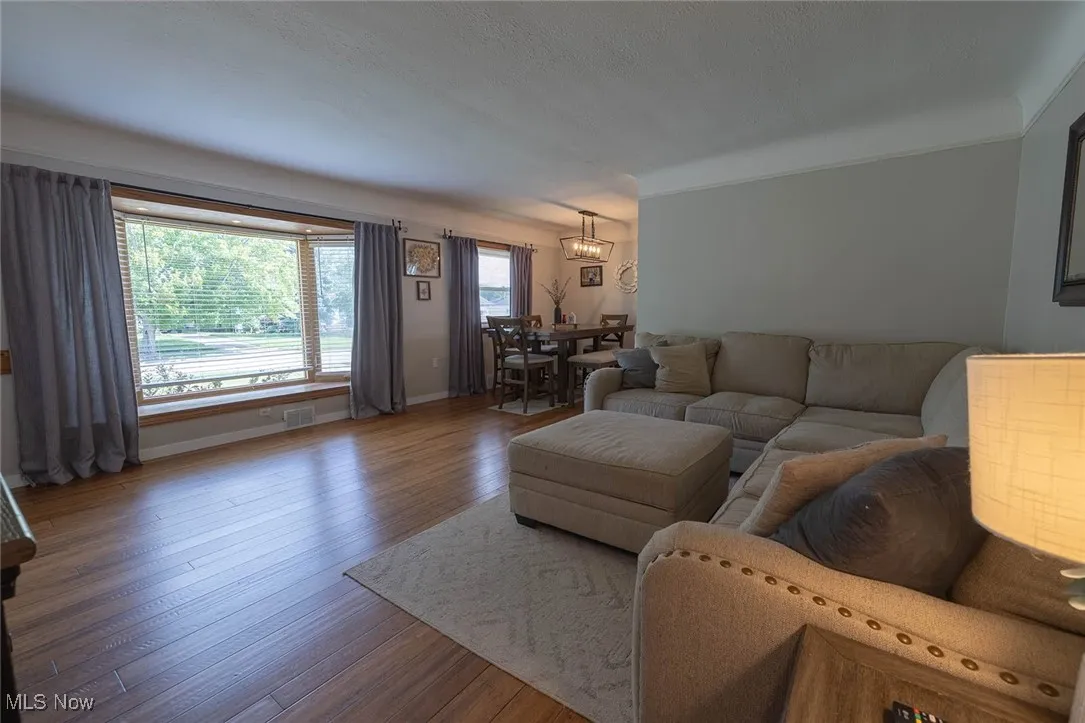 Living room featuring baseboards and wood finished floors