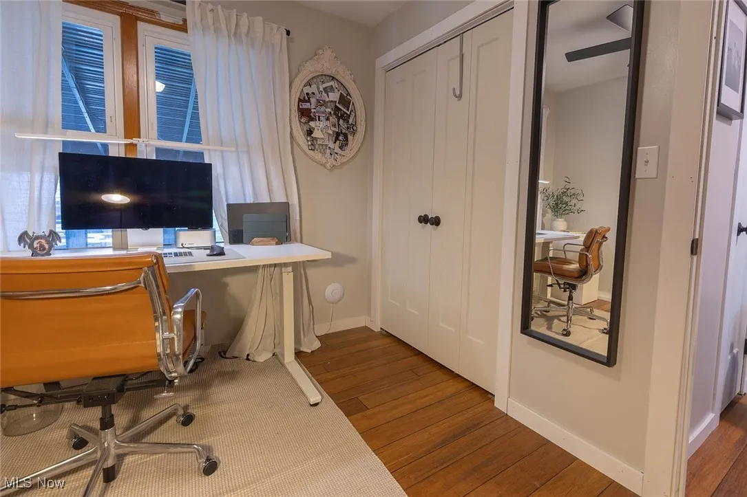 Office area featuring baseboards and wood finished floors