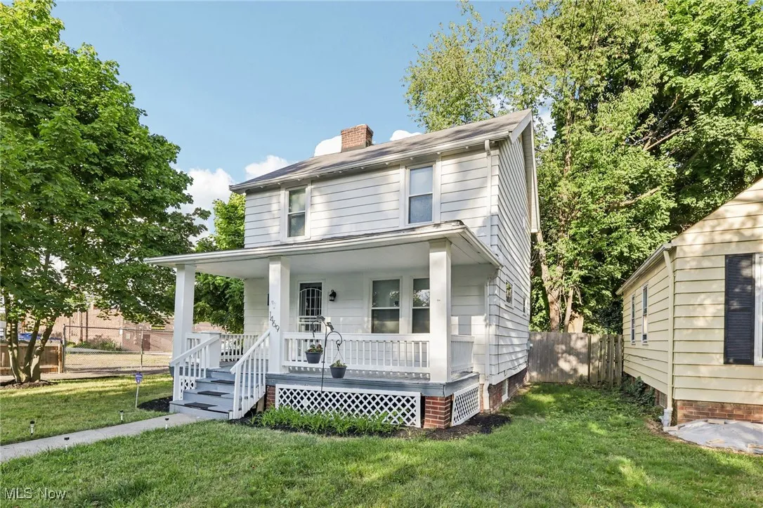 Traditional style home featuring a porch and a chimney