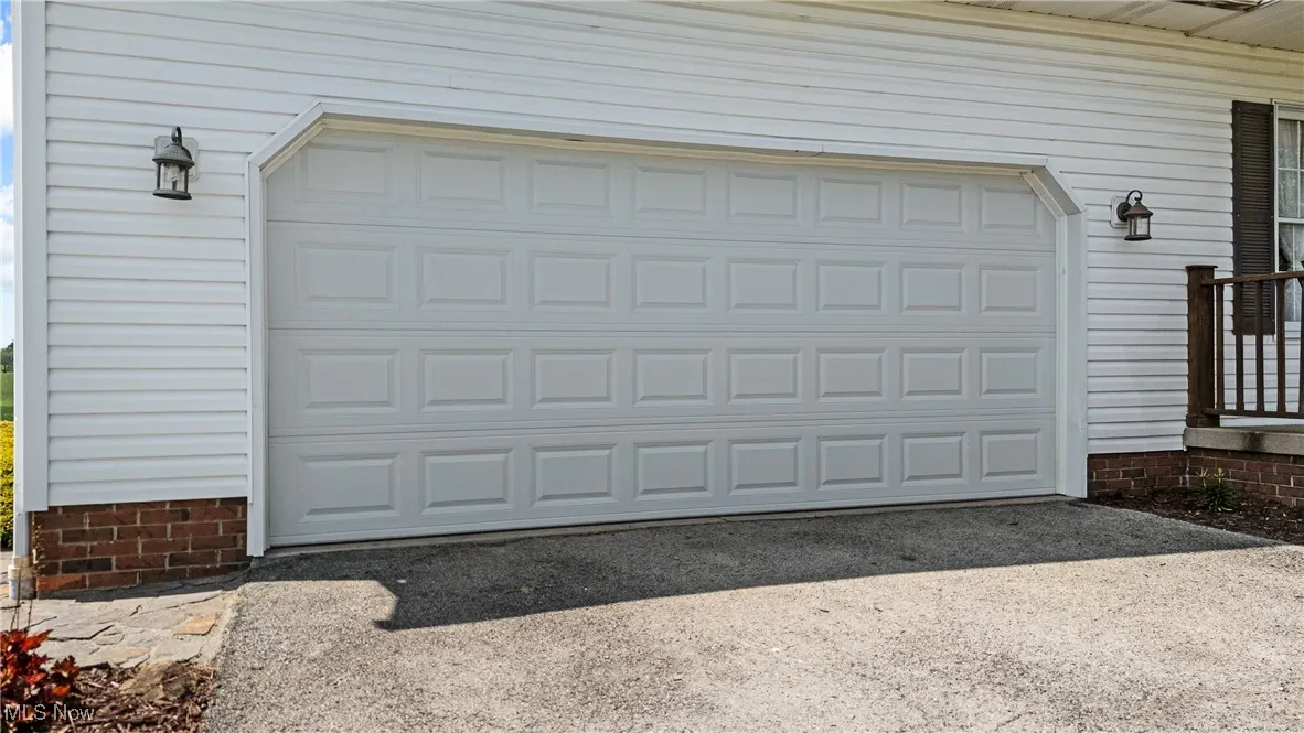 Garage featuring driveway