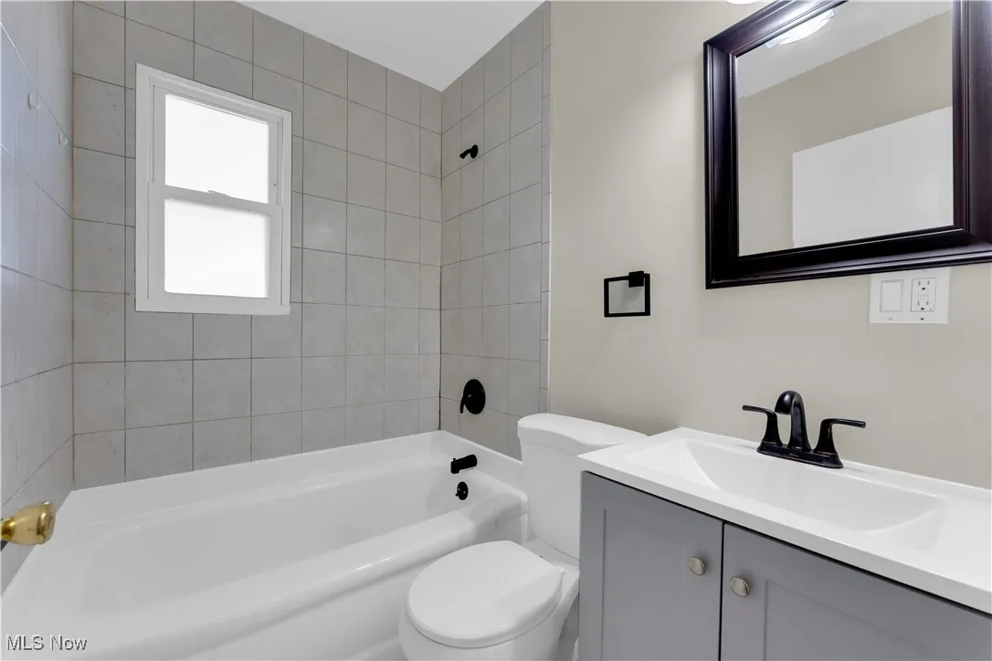 Full bathroom with  shower combination and vanity