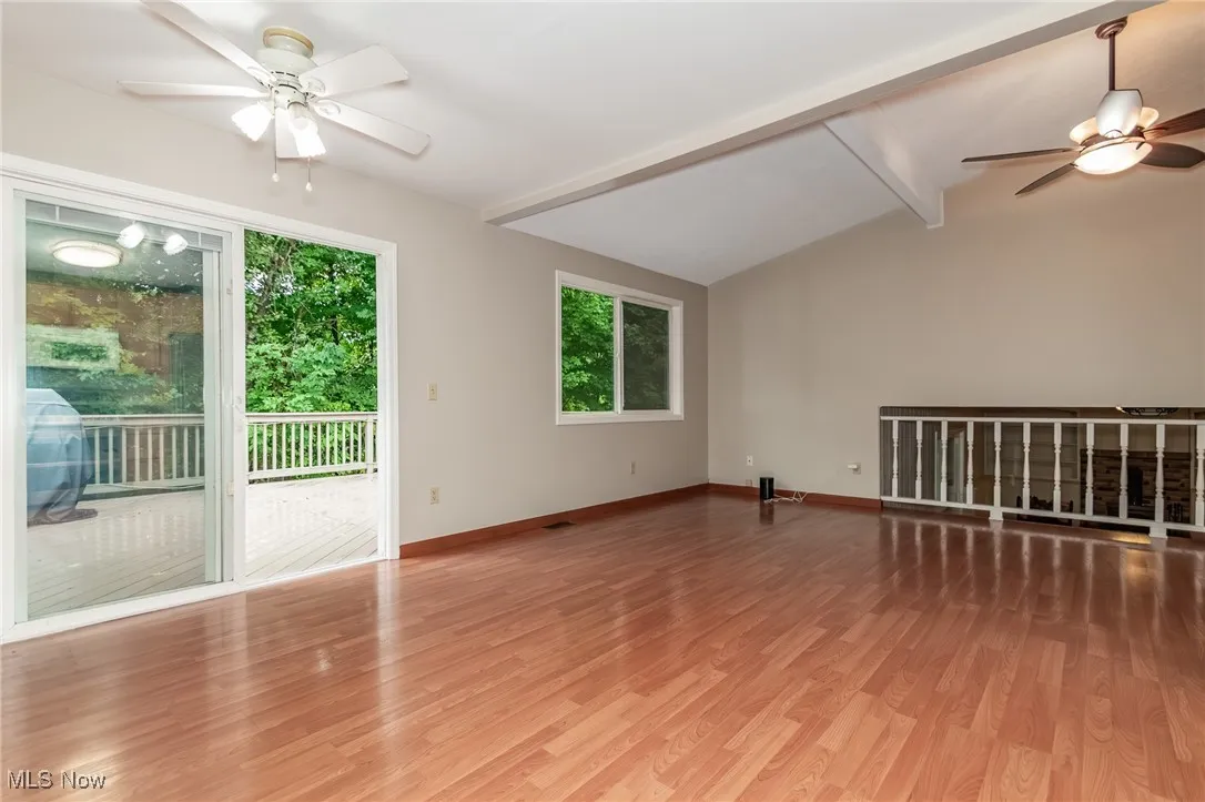 Spare room featuring ceiling fan and light wood-style floors